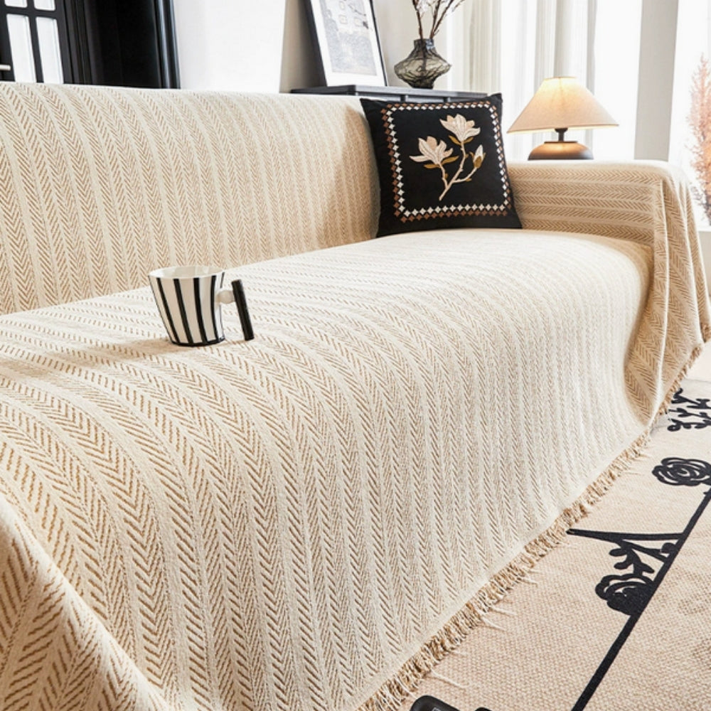 Sofatrekk i chenille med fiskebensmønster og dusker – Beige