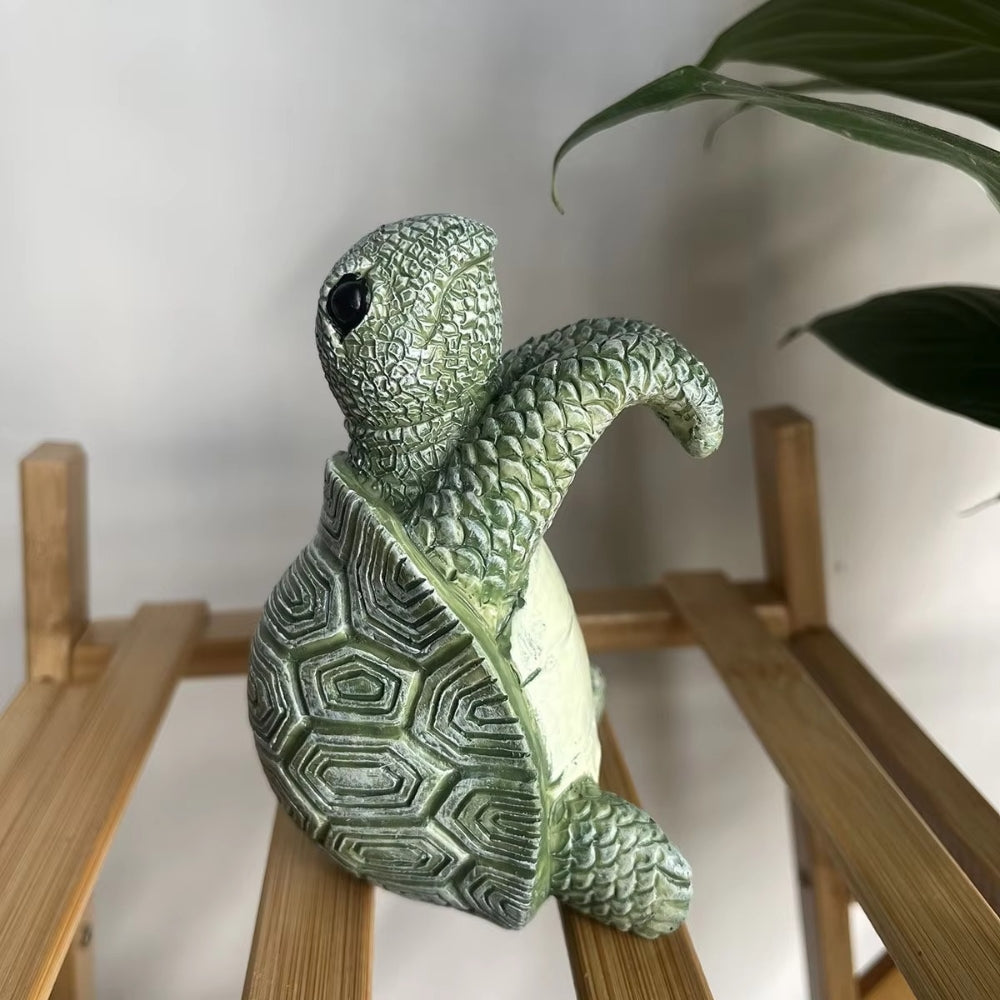 Arden hengende skilpaddefigur i resin