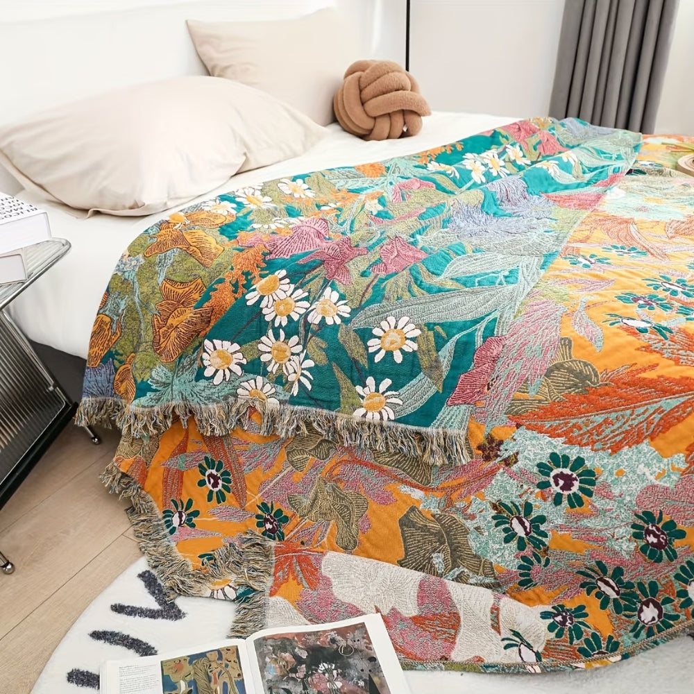 Bohemsk bomullspledd med blomsterpatchwork og dusker