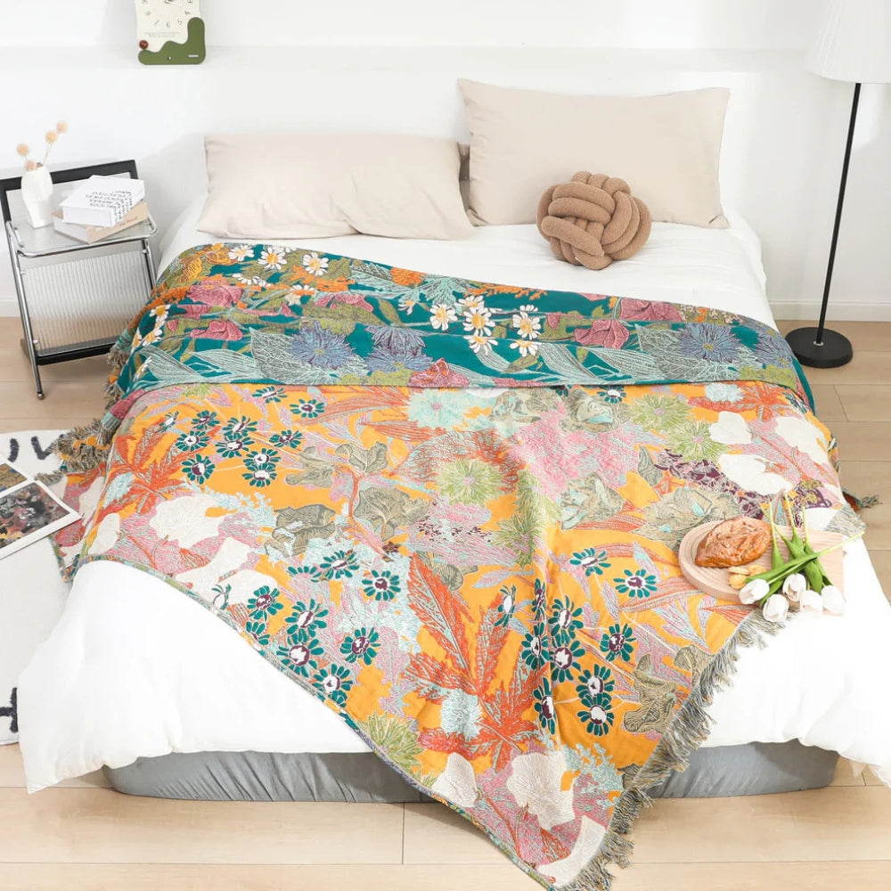 Bohemsk bomullspledd med blomsterpatchwork og dusker