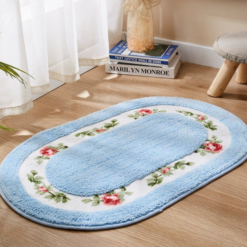 Oval plysjbadematte med blomster