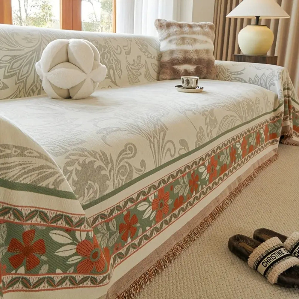 Boho-sofatrekk med blomster og dusker
