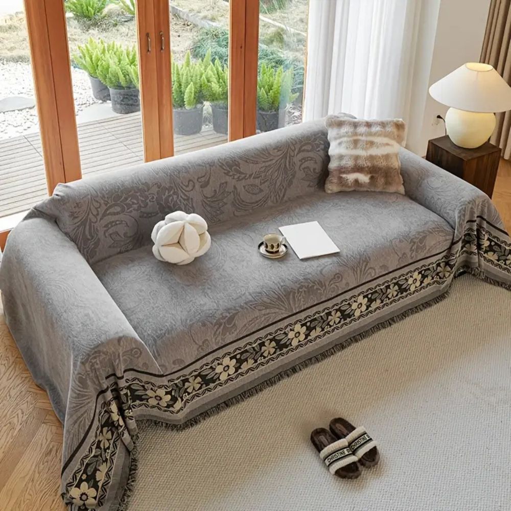 Boho-sofatrekk med blomster og dusker