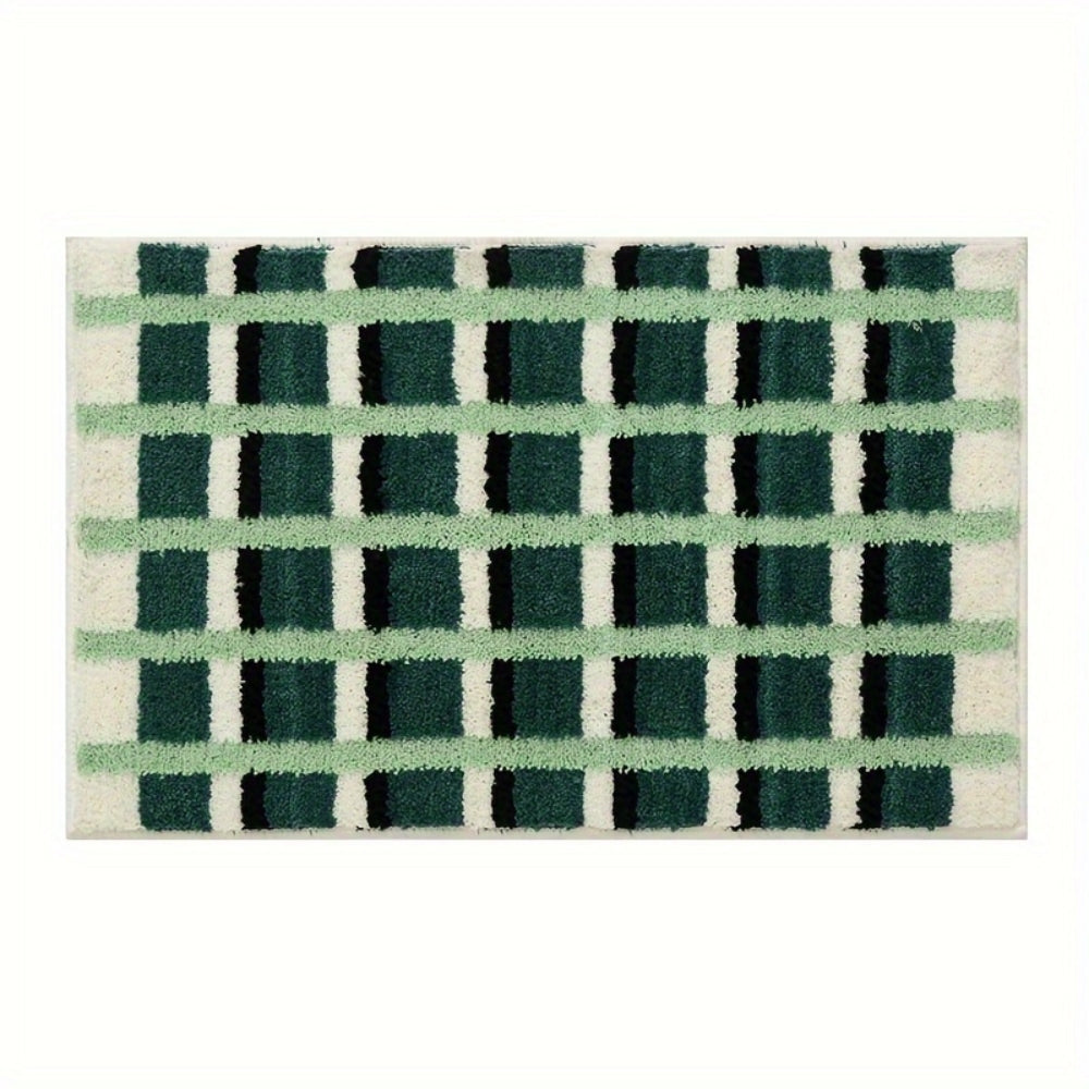Mosegrønn badematte med geometrisk flokkmønster