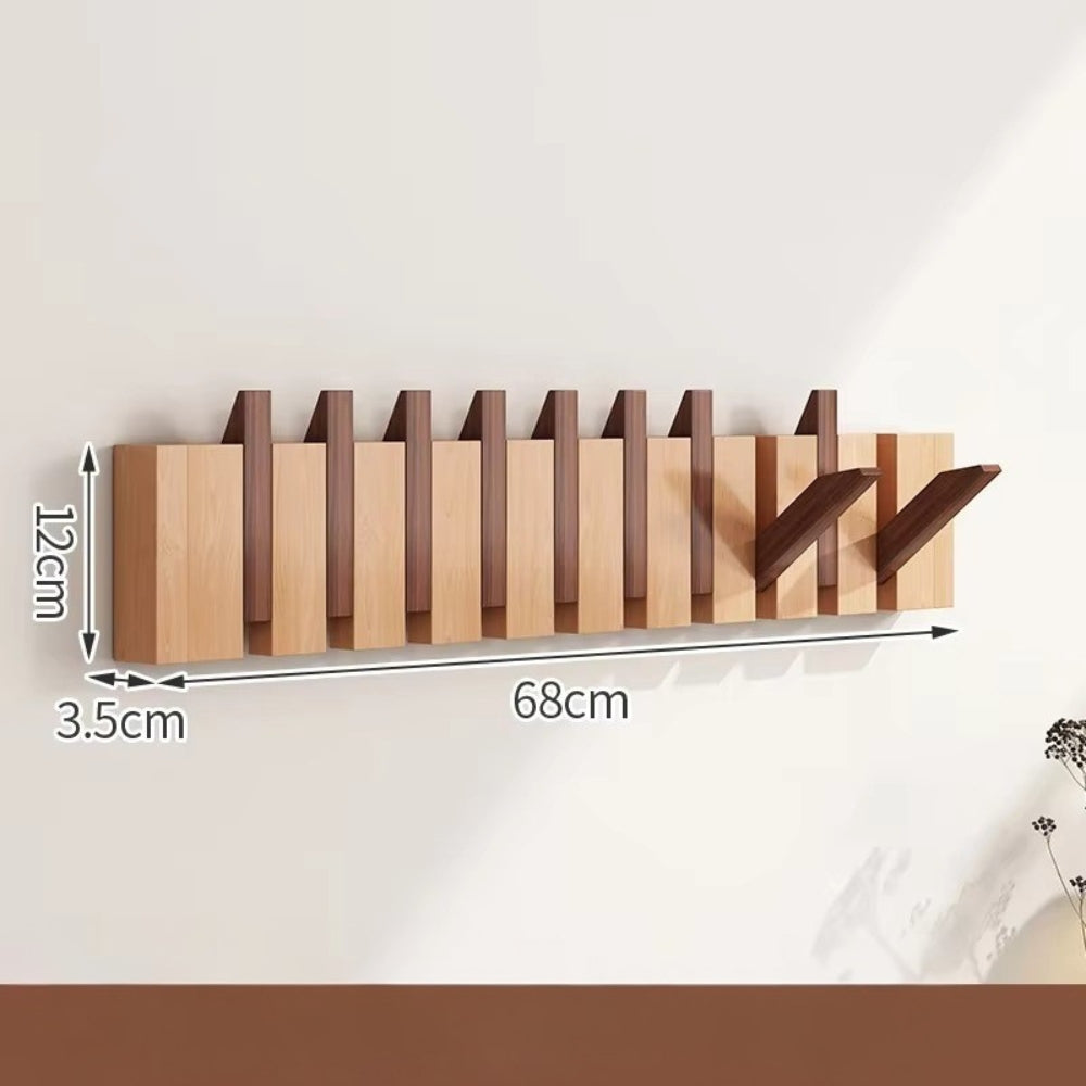 Sammenleggbar veggknagg i tre med pianodesign