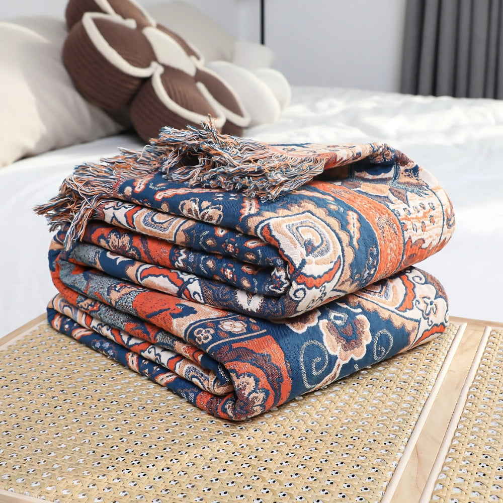 Solea bomullspledd i blomsterjacquard